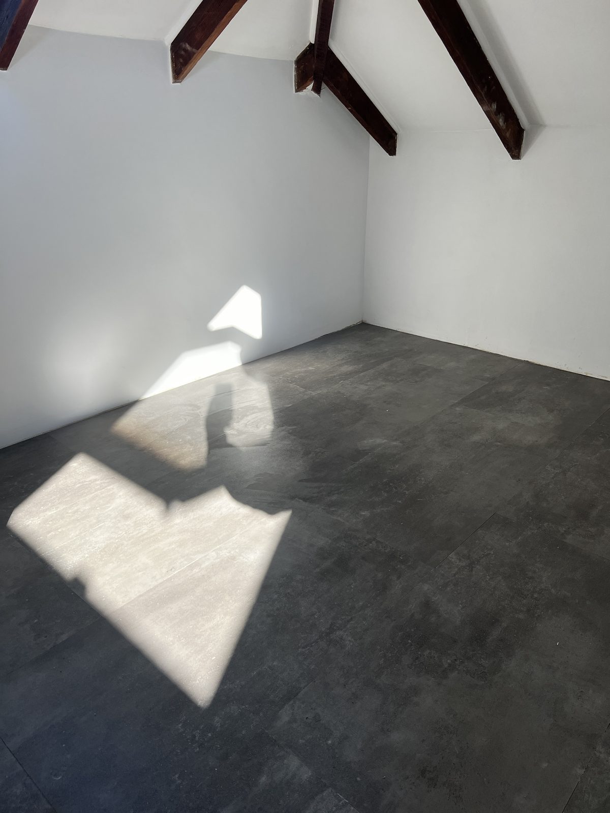 Vinyl tiles installed over a prepared attic floor in Mowbray