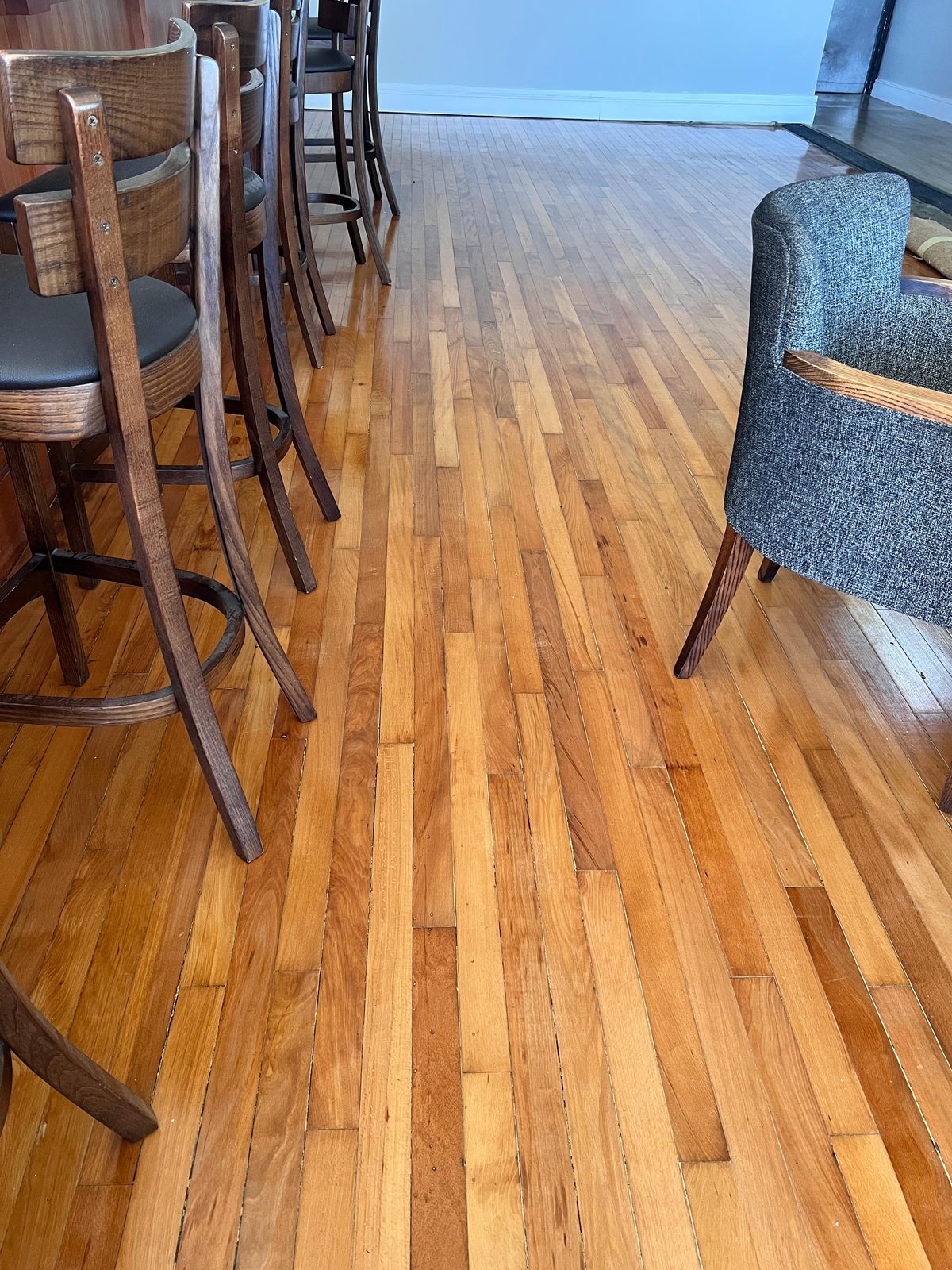 Original wooden floor revealed after lifting the old carpet