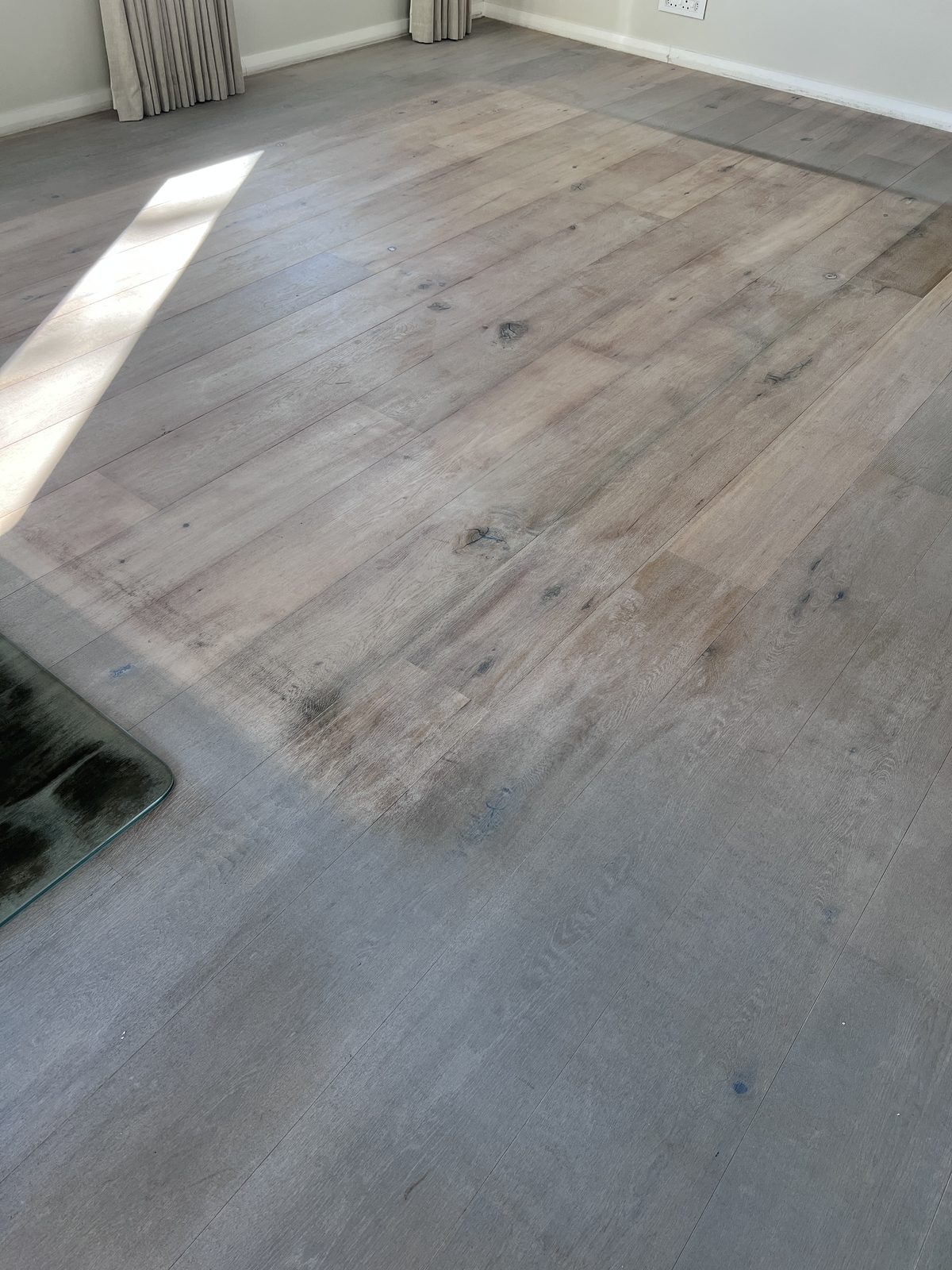 Engineered oak floor before restoration, greyed and worn