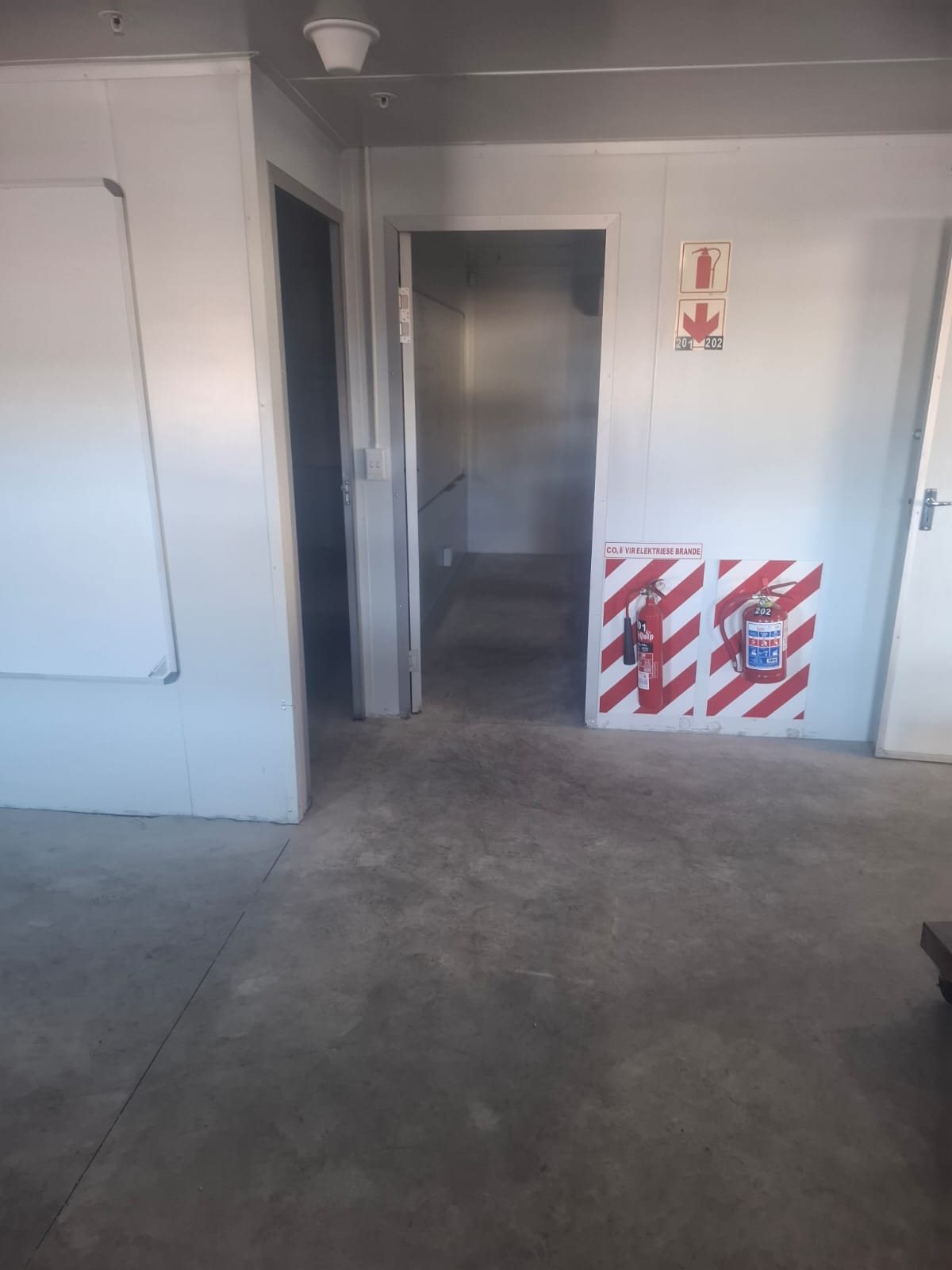 Bare concrete slab in a packing room at Stellenpak Fruit Packers, Paarl, before flooring